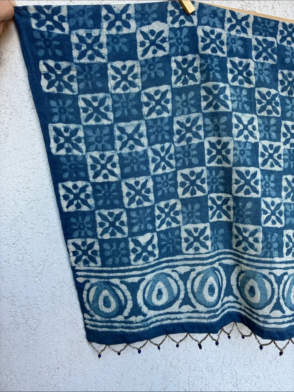 Blue & white  batik patterned short curtain or valance with beaded trim.